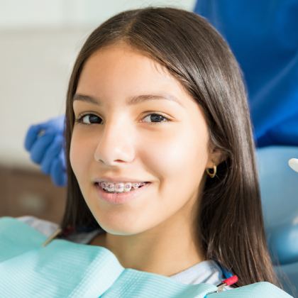 man smiling in dentists chair